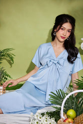 Silk Midi Dress with V-Neckline and Statement Bow Detail